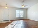 Living room with hardwood floors and a door to outside at 733 Cherry Laurel St, Minneola, FL 34715