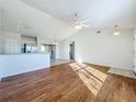 Bright living room with hardwood floors and high ceilings at 733 Cherry Laurel St, Minneola, FL 34715