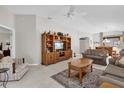 Living room with built-in entertainment center and comfy seating at 814 Hilda Way, The Villages, FL 32162