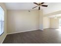 Spacious living room with dark laminate flooring and high ceilings at 870 Vindale Rd, Tavares, FL 32778