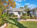 House exterior showcasing a well-maintained lawn and entrance at 15729 Greater Groves Blvd, Clermont, FL 34714