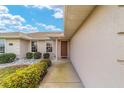 Inviting front entrance with lush landscaping, and a well-maintained walkway at 17457 Se 121St Cir, Summerfield, FL 34491