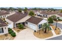 Bird's eye view of tan house in a neighborhood at 2222 Southwood Dr, The Villages, FL 32162