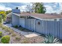 Charming single story home with a fence, well-maintained lawn, elegant landscaping and carport at 2384 Orange Capital Ct, Eustis, FL 32726