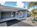 Charming single story home featuring a well-maintained lawn, elegant landscaping and carport at 2384 Orange Capital Ct, Eustis, FL 32726