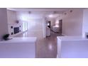 Bright living room with fireplace, white trim and open floor plan perfect for entertaining at 2384 Orange Capital Ct, Eustis, FL 32726