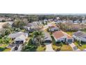 Aerial view of a neighborhood with houses and palm trees at 25324 Hibiscus St, Leesburg, FL 34748