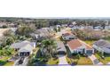 Aerial view of a single Gathering home in a residential neighborhood at 25324 Hibiscus St, Leesburg, FL 34748