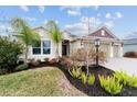 Two-story house with a landscaped yard and a three-car garage at 3769 Causey Ct, The Villages, FL 32163