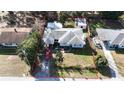 Aerial view of the home with property lines, including a shed and a nicely maintained yard at 1202 Deidrich Ct, Eustis, FL 32726