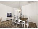 Dining room features a wooden table and decorative chairs and plenty of space for entertaining at 1770 Usrey Ct, The Villages, FL 34762