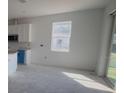 Spacious kitchen features white cabinets, a window view, and lots of natural light at 2803 Supermarine Rd, Tavares, FL 32778