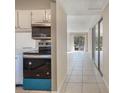A modern kitchen featuring stainless steel appliances, sleek countertops, and a well-lit dining area at 2804 N Powers Dr # 27, Orlando, FL 32818