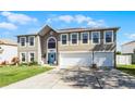 Charming two-story home with well-maintained lawn, three-car garage, and inviting curb appeal at 3215 Park Branch Ave, Clermont, FL 34711