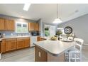 Sunlit kitchen with ample counter space, wood cabinets, and modern appliances at 3218 Woodridge Dr, The Villages, FL 32162