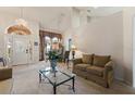 Bright living room with tile floors and chandelier at 3310 Osprey Hill St, Clermont, FL 34714