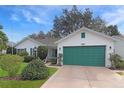 Charming single-story home featuring a well-maintained lawn and attached two-car garage at 4034 River Crest Cir, Leesburg, FL 34748