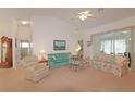 Bright living room with vaulted ceilings and comfortable seating, perfect for relaxation at 4034 River Crest Cir, Leesburg, FL 34748