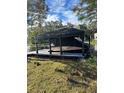 Covered boat lift on private dock at 5910 Lake Emma Ct, Groveland, FL 34736