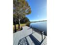 Serene lakeside dock with bench, offering peaceful views at 5910 Lake Emma Ct, Groveland, FL 34736