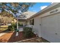 Exterior view of a single story home with white siding and black shutters at 8862 Sw 92Nd St # D, Ocala, FL 34481