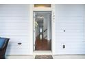 Inviting entryway view showcasing the hardwood floors, light colored walls and access to the home at 1041 Linehart Dr, Winter Garden, FL 34787