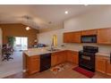 Functional kitchen featuring ample counter space and a breakfast bar, perfect for meal prep at 1123 Bluegrass Dr, Groveland, FL 34736