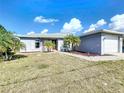 Charming single-story home with a well-maintained yard, driveway, and two-car garage at 119 Cory Ct, Auburndale, FL 33823