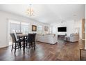 Bright and airy living room with wood floors, a ceiling fan, and large sliding glass doors at 1930 Rhett Rd, The Villages, FL 32163