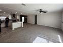 Open-concept living area with neutral carpet and walls, providing a versatile space for entertaining and relaxation at 19875 Rose Rd, Altoona, FL 32702