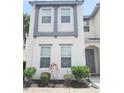 Charming two-story home with modern design, attractive landscaping, and a welcoming front entrance at 294 Captiva Dr, Davenport, FL 33896