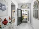 Bright foyer with marble floors, showcasing an open doorway, stylish decor, and natural light at 3782 Avon Ct, Clermont, FL 34711