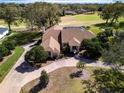 Expansive single-Gathering home with a screened-in pool, set on a lush lot with golf course views at 5746 Crestview Dr, Lady Lake, FL 32159