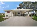 Spacious carport with ample parking and easy access to the home's entrance at 8 Gallinule Ct, Fruitland Park, FL 34731