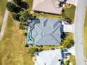 An aerial view of a backyard pool and the home's roof at 1044 Alcove Loop, The Villages, FL 32162