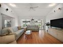 Bright and airy living room featuring wood floors and comfortable seating perfect for entertaining at 1508 Dellano Way, The Villages, FL 32159