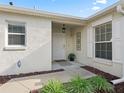 Welcoming front entrance with a covered porch and tasteful decorative details at 1558 Summerchase Loop, The Villages, FL 32162