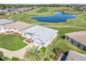 Aerial view showcasing the home's premium lot with golf course and lake frontage at 17899 Se 115Th Cir, Summerfield, FL 34491