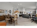 Spacious open-concept living area with a ceiling fan, neutral walls and light-colored tile at 1817 Orange Ct, The Villages, FL 32162