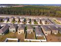 Aerial view of a home in a community, surrounded by a white fence at 2024 Hemingway Cir, Groveland, FL 34736