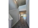 Bright foyer featuring soaring ceilings, neutral walls, and sleek tile flooring leading to the living area at 2036 Sunshine Peak Dr, Minneola, FL 34715