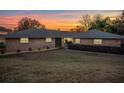 Charming single story home with brick facade, green front door and manicured landscaping at 2422 Topping Pl, Eustis, FL 32726