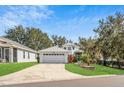 Charming two-story home with well-manicured lawn and two car garage at 6250 Sailboat Ave, Tavares, FL 32778