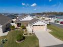 Beautiful aerial view of a home with a well-manicured lawn in a vibrant community at 6576 Merrill Ln, The Villages, FL 34762