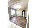 Elegant dining room with wood floors, chandelier, and lots of natural light at 1263 Legendary Blvd, Clermont, FL 34711