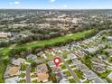 Aerial view of a residential community, showcasing the layout of the neighborhood and nearby golf course at 1303 Fontana Ct, Lady Lake, FL 32159