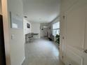 Bright foyer with tile flooring and a view into the dining area at 1799 Post Oak Dr, Davenport, FL 33837