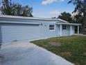 A single-story house with a garage and small, well-manicured front lawn at 301 Clark St, Maitland, FL 32751