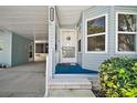 Cozy covered entrance leading to the front door of the home at 3323 Manatee Rd, Tavares, FL 32778