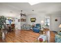 Open living room with a ceiling fan and hardwood floors at 3323 Manatee Rd, Tavares, FL 32778